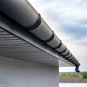 Close up of black, half round gutters