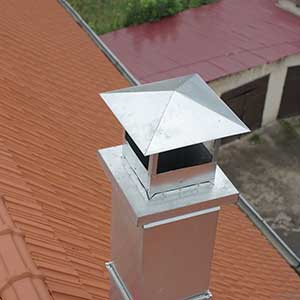 Metal chimney with a metal cap